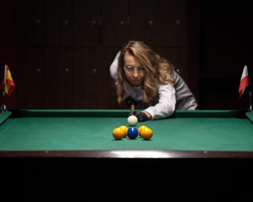 Scientists at the IPC PAS strike the complex process. They are targeting copper using an organic molecule that may help inhibit copper's toxicity in Alzheimer’s disease. The photo was taken thanks to the kind cooperation of the Arena Billiards Club in Warsaw. Photo courtesy: Grzegorz Krzyzewski